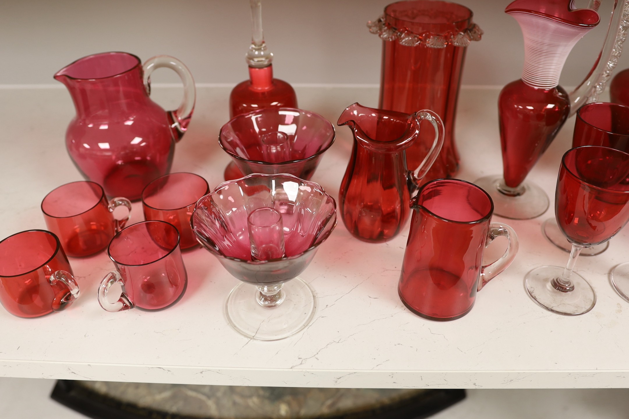 A quantity of various late 19th/early 20th century cranberry glass